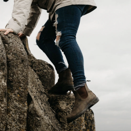 Person climbing in Blundstone Chelsea boots