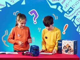 Two kids playing with a model truck