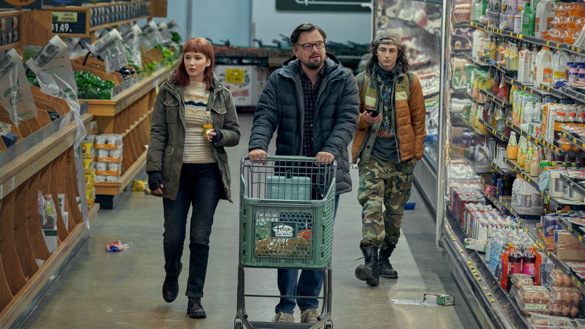 Jennifer Lawrence, Leonardo DiCaprio, and Timothée Chalamet in a grocery store.