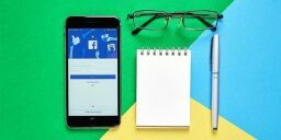 Phone, notepad, glasses, and pen