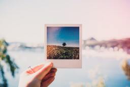 Holding up photo