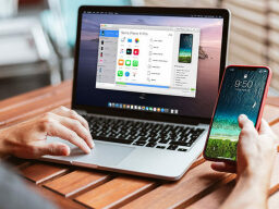 Laptop showing sync screen with iPhone