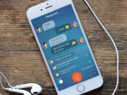 Phone with earphones and language learning chatbox app