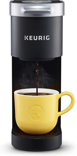Black coffee machine with yellow cup