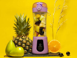 JustBlend Portable Blender on a yellow background.