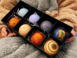 Set of lamps shaped like planets in box