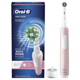 Pink electric toothbrush with box and charging stand