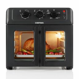the chefman french door air fryer+ oven with a whole rotisserie chicken inside