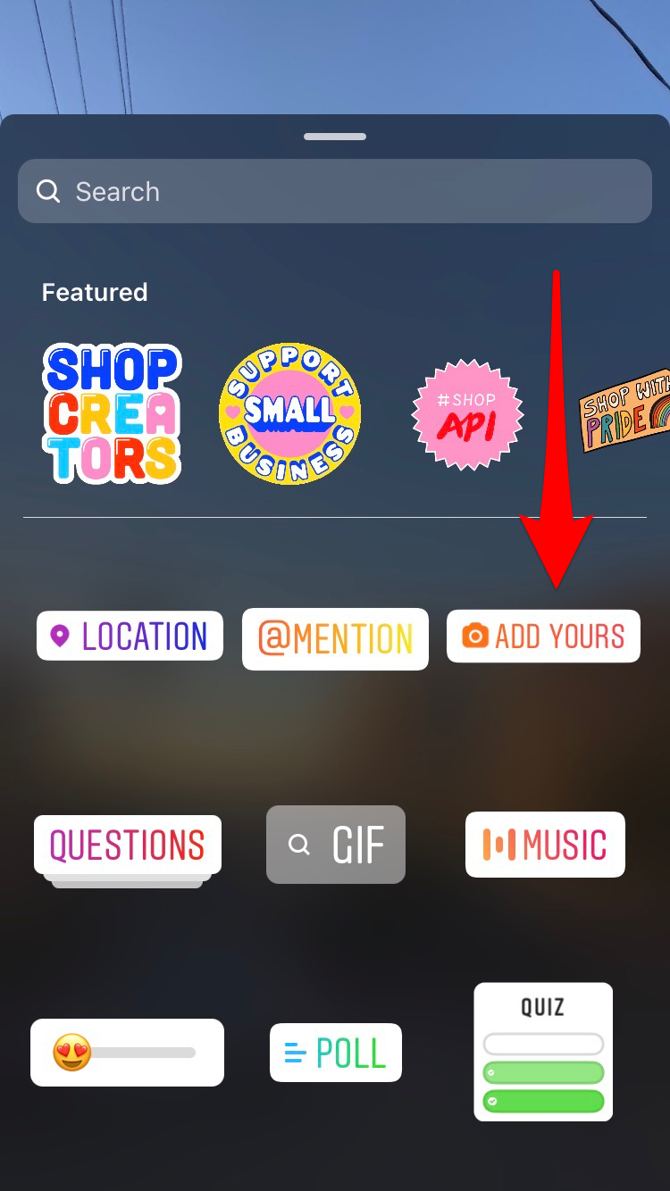 Screenshot of Instagram with an arrow pointing to the square smiley face sticker icon.
