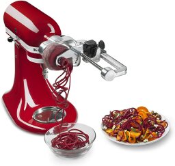 a kitchenaid spiralizer attachment on a mixer spiralizing a beet