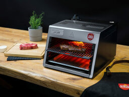 Otto Lite: Professional 1,500°F Steak Grill on a table.