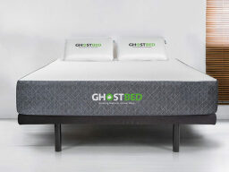 White mattress on bedframe
