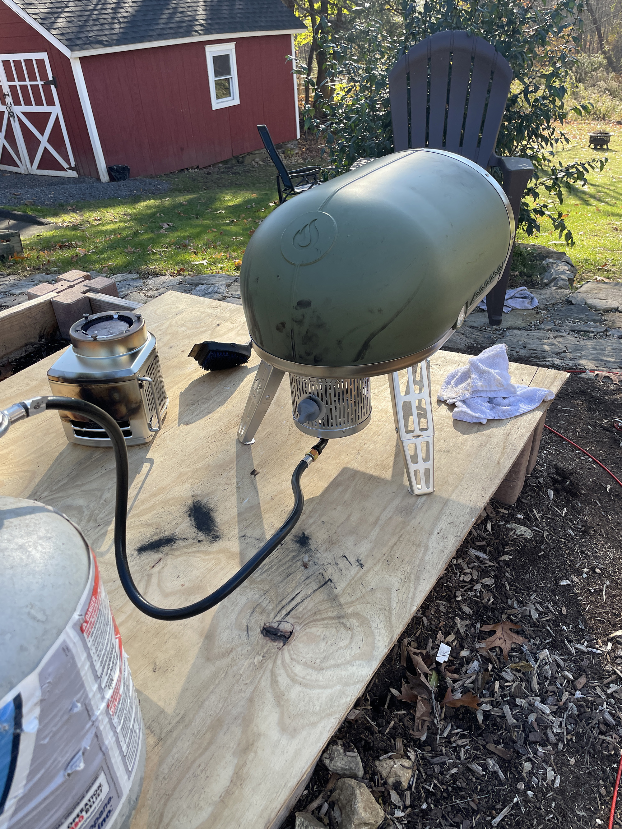The Roccbox setup with the included gas burner connected to a propane tank