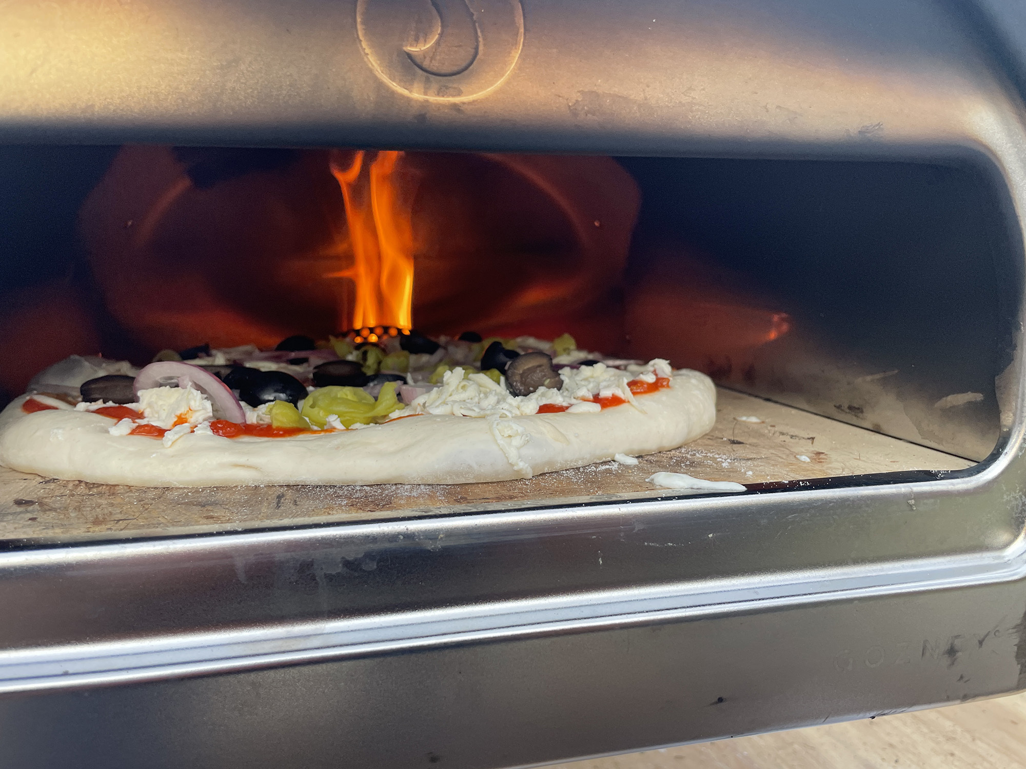 Cooking a pizza with the Roccbox