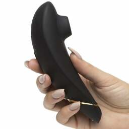 a hand holding the womanizer premium 