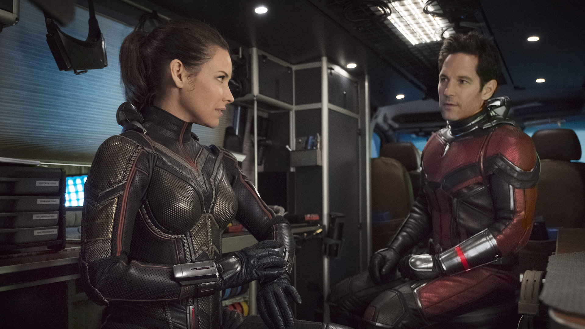 Hope (Evangeline Lilly) and Scott (Paul Rudd) talk while wearing in futuristic metal armor.