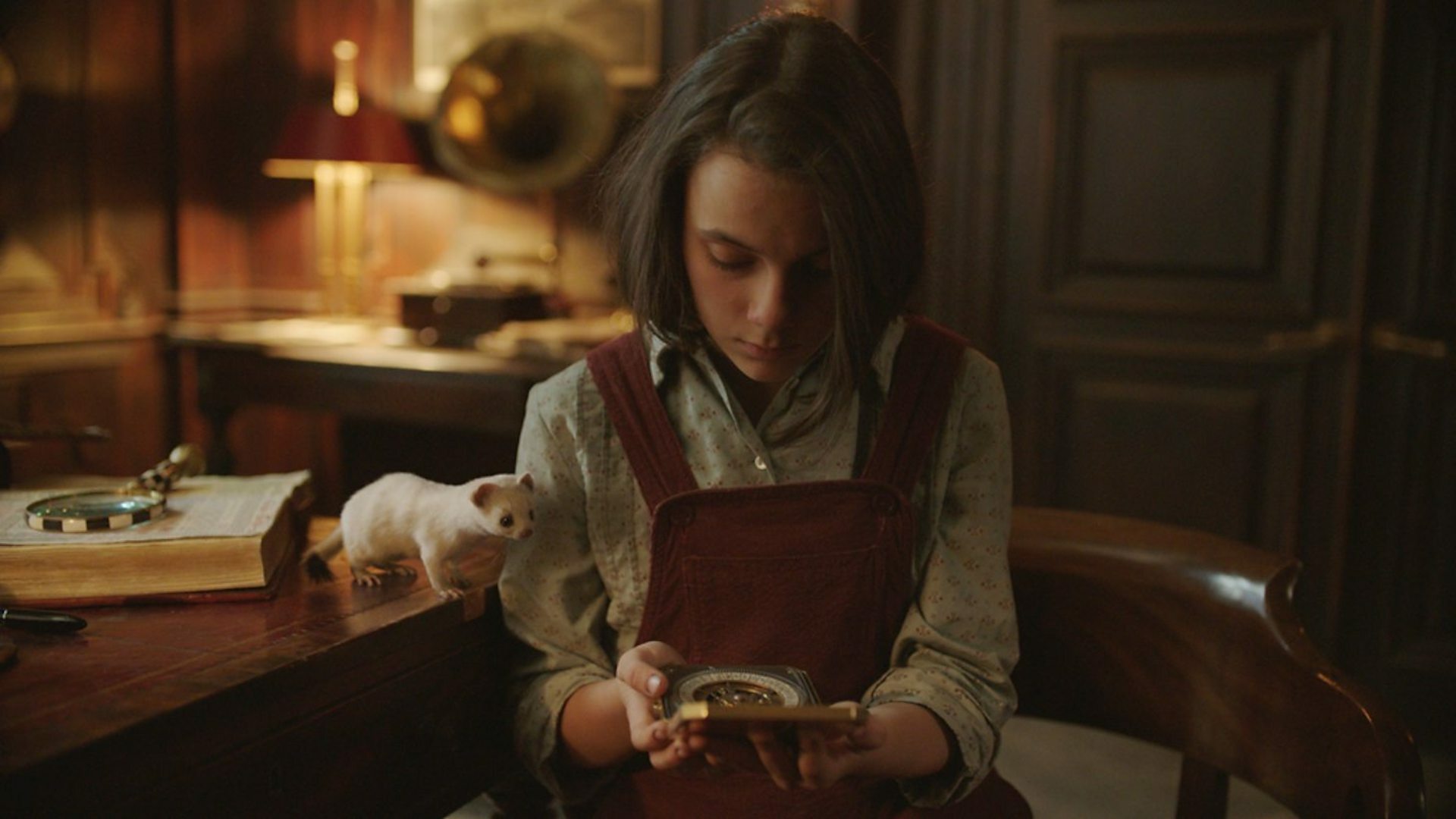 Lyra (Dafne Keen) and Pantalaimon in the BBC's "His Dark Materials".