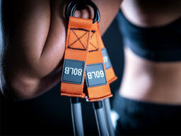 Someone holding the TorroBand: Powerful Resistance Band Trainer.