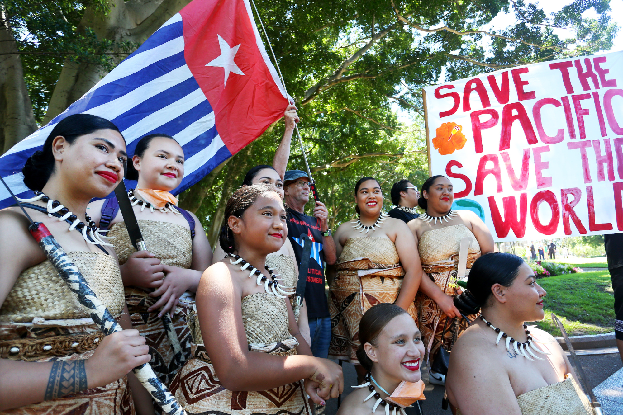 Climate activists representing the Pacific Islands gather during the protest at Hyde Park in Sydney, Australia.