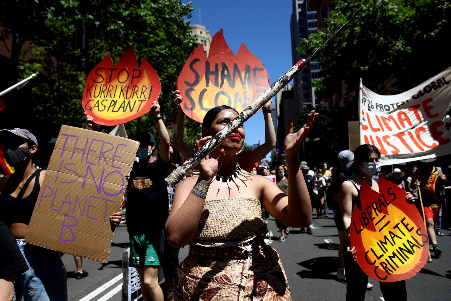 Protesters walked down Elizabeth Street in Sydney demanding world leaders act decisively on climate change.