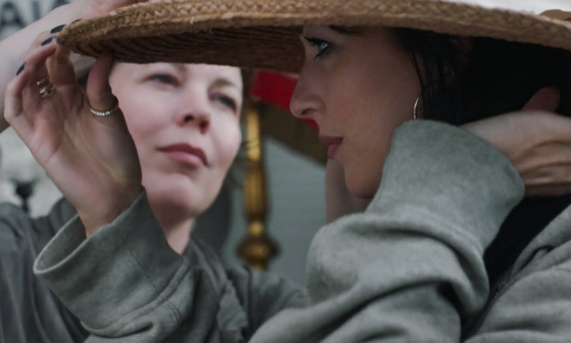 Olivia Colman looks longingly at Dakota Johnson in "The Lost Daughter"