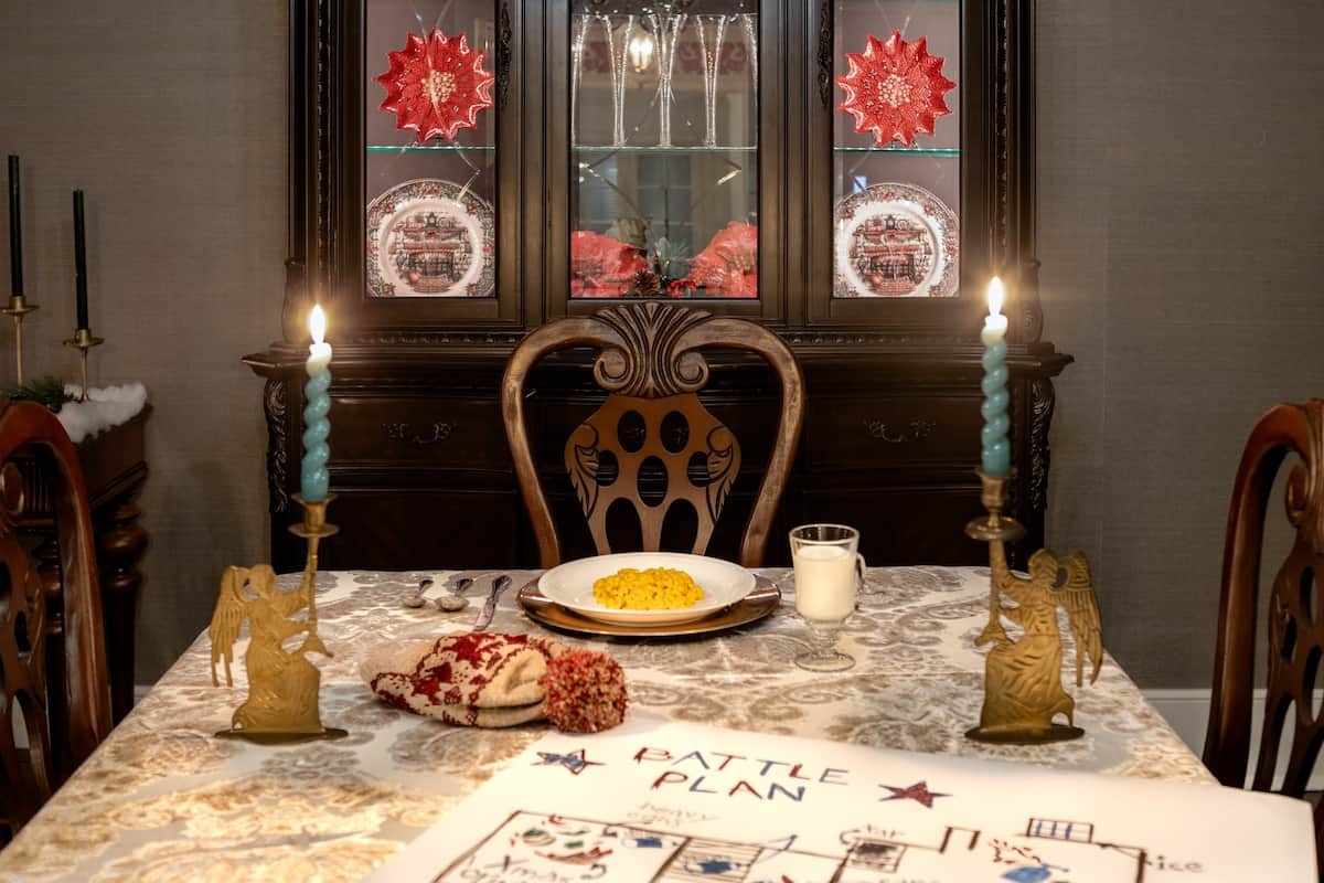 A dining table fully set at the "Home Alone" Airbnb, like Kevin McAllister does in the film.