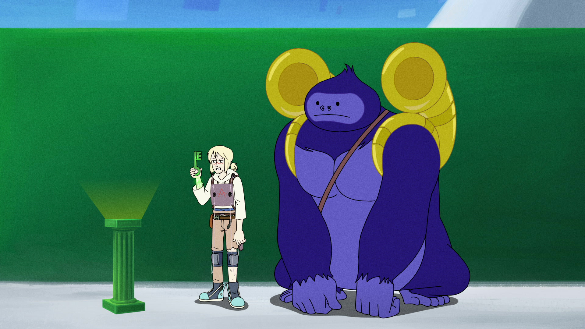 A person holds a grey key while standing next to a giant purple gorilla.