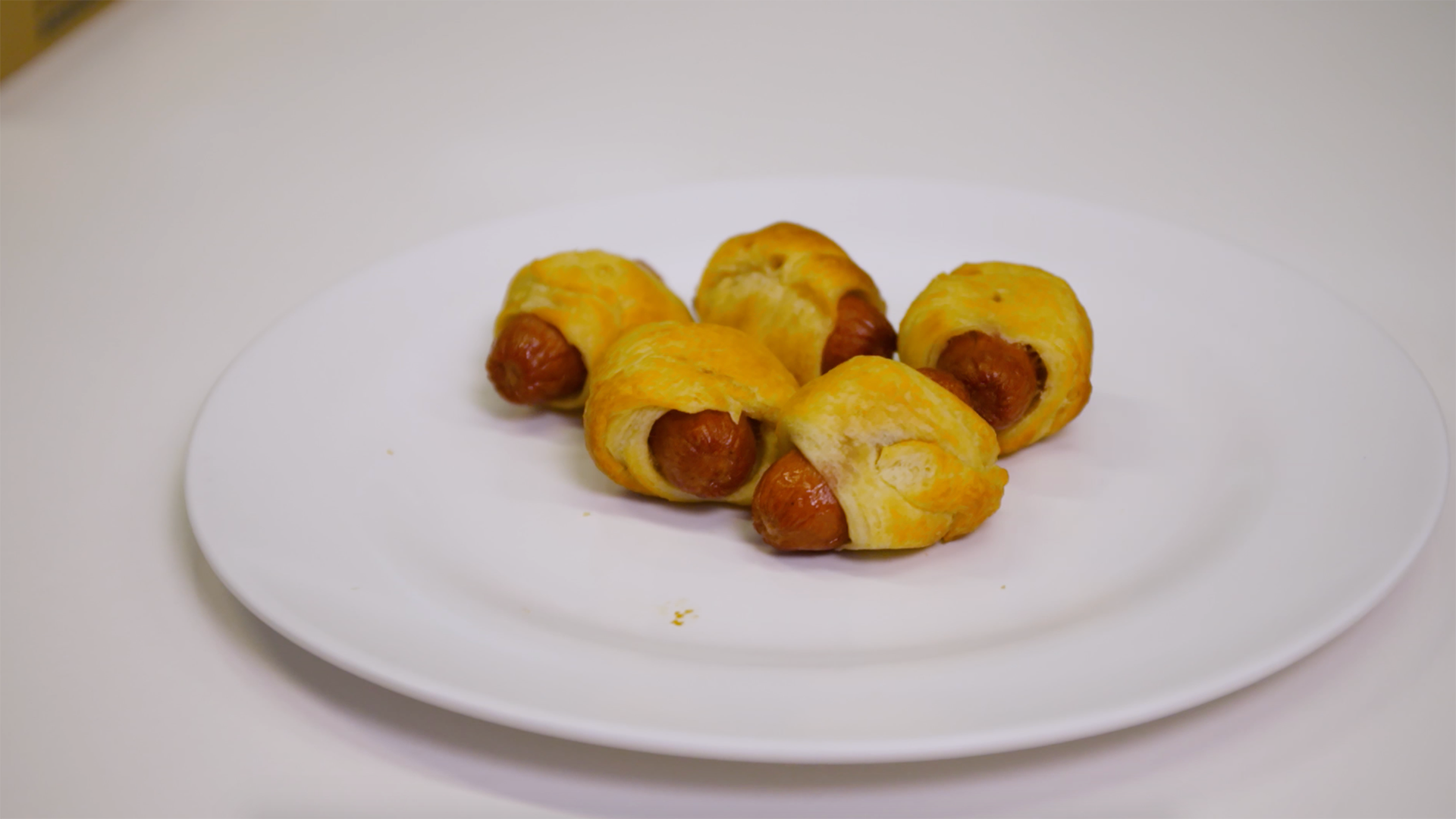 pigs in a blanket on a plate