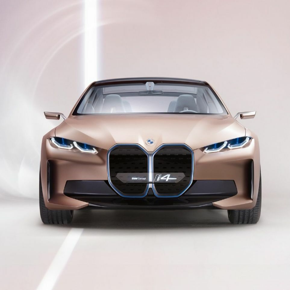 Rose gold car with kidney-shaped grille facing forward.