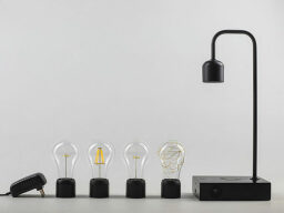 Row of lightbulbs next to black stand
