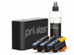 Black printer with spray bottle of skin primer and three ink cartridges
