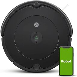 Black robot vacuum and phone on iRobot screen on white background