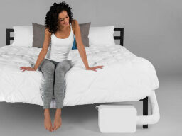 BedJet 3 Climate Comfort Sleep System and Aromatherapy Upgrade Bundle on a bed.