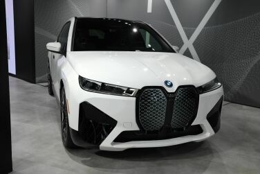 A white BMW car facing forward.