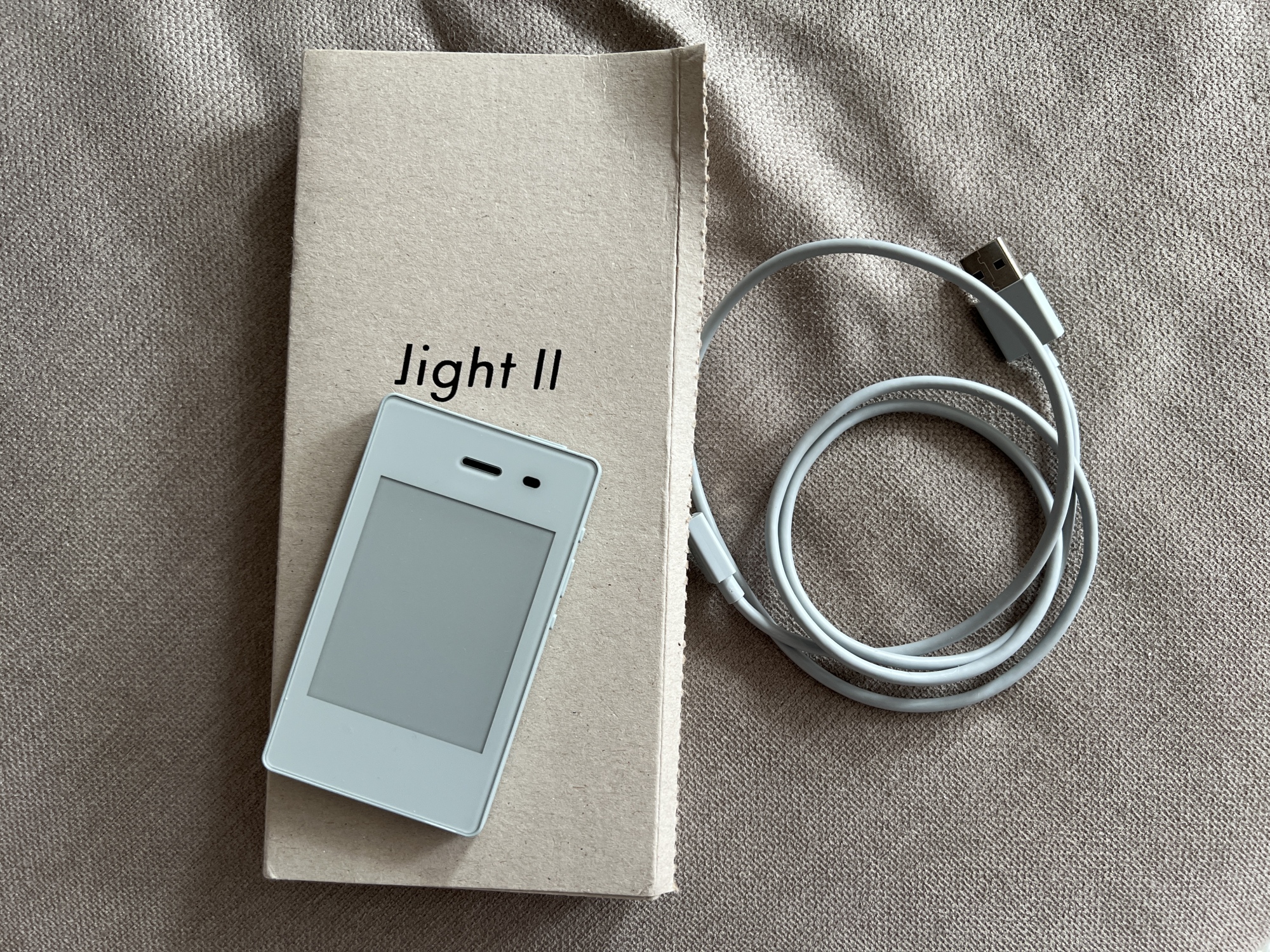 The Light Phone II and everything that comes in the box – which is literally just the charging cord. Figure out your own adapter!