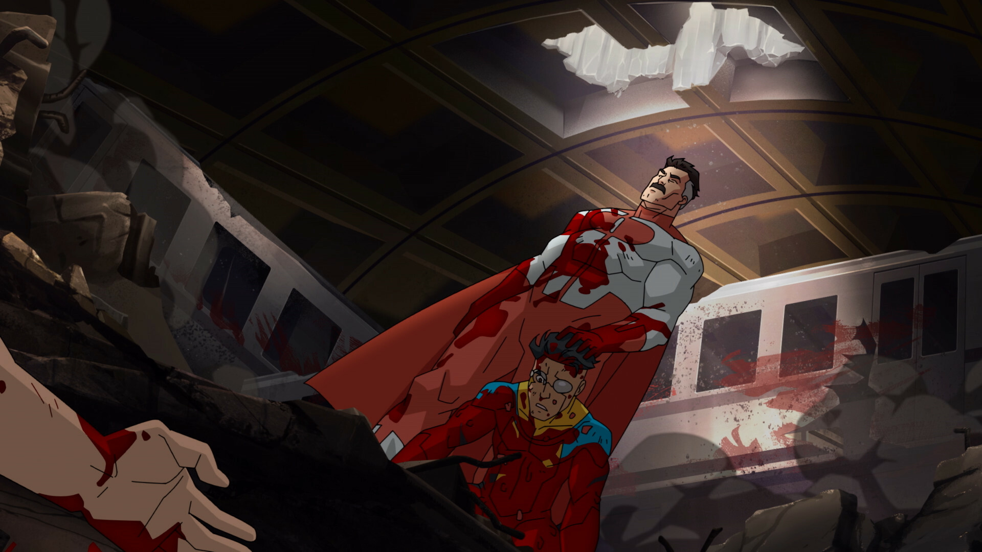 A caped superhero stands in the wreckage of a subway tunnel, forcing another superhero to kneel
