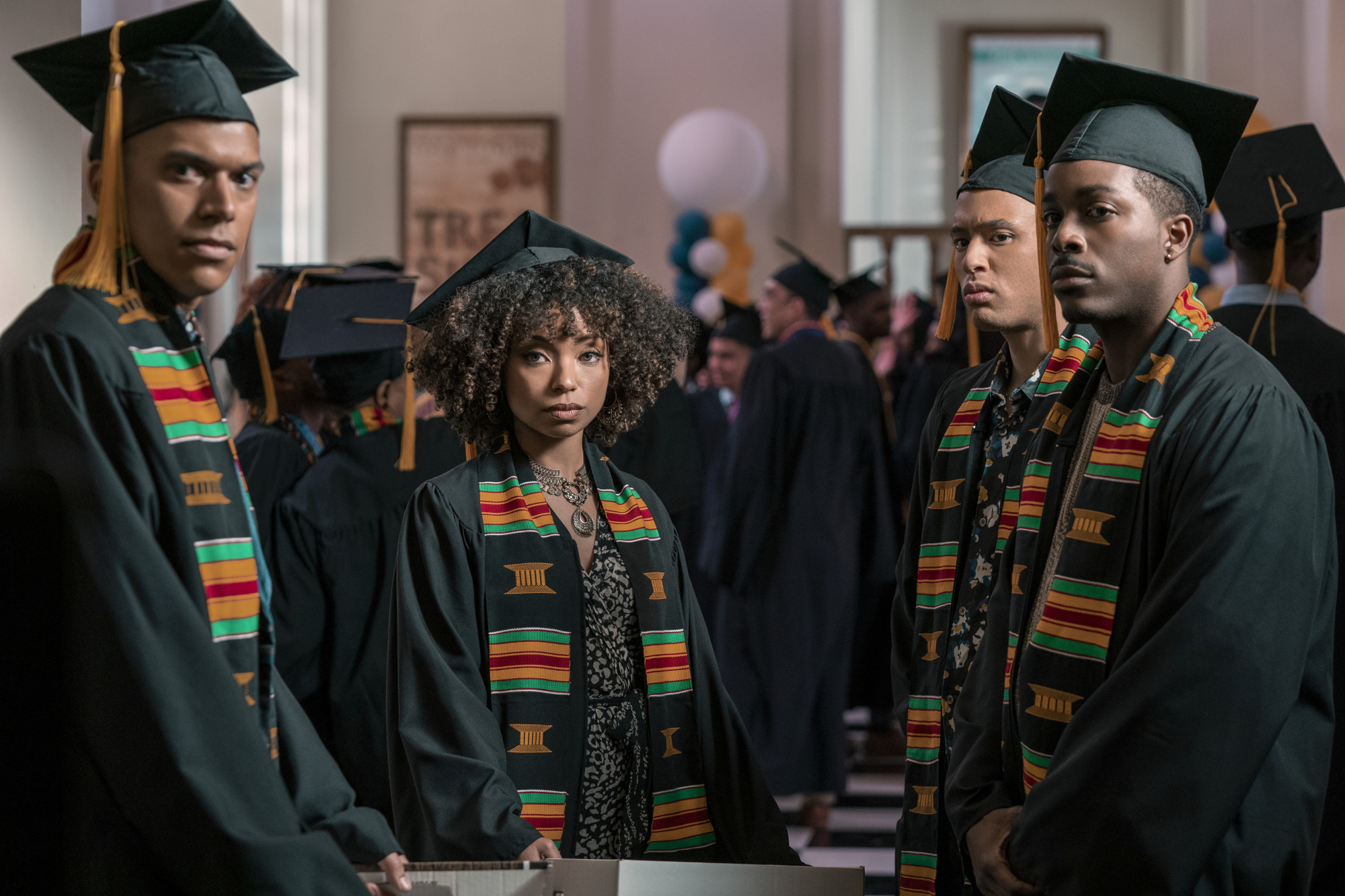 Black students in graduation cap and gown.