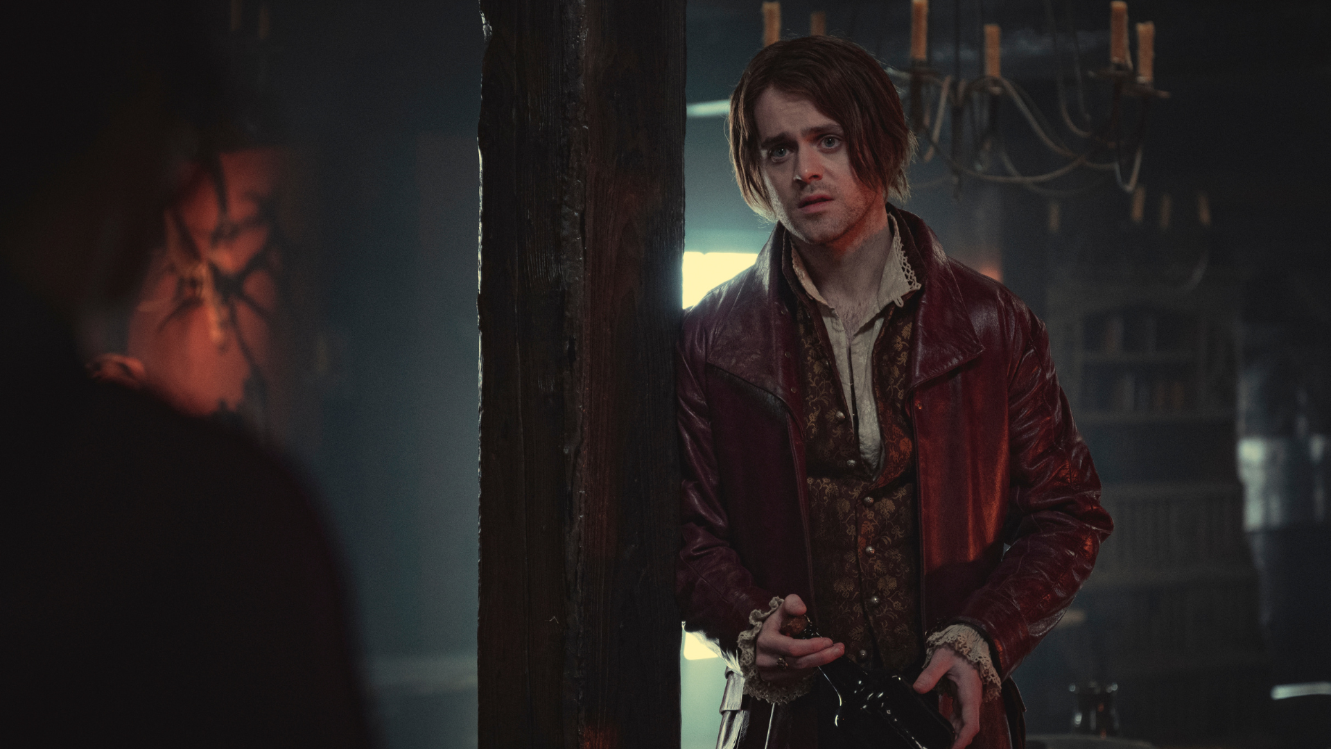A man in a red doublet.