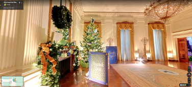 Thank you cards at the base of a White House Christmas tree.