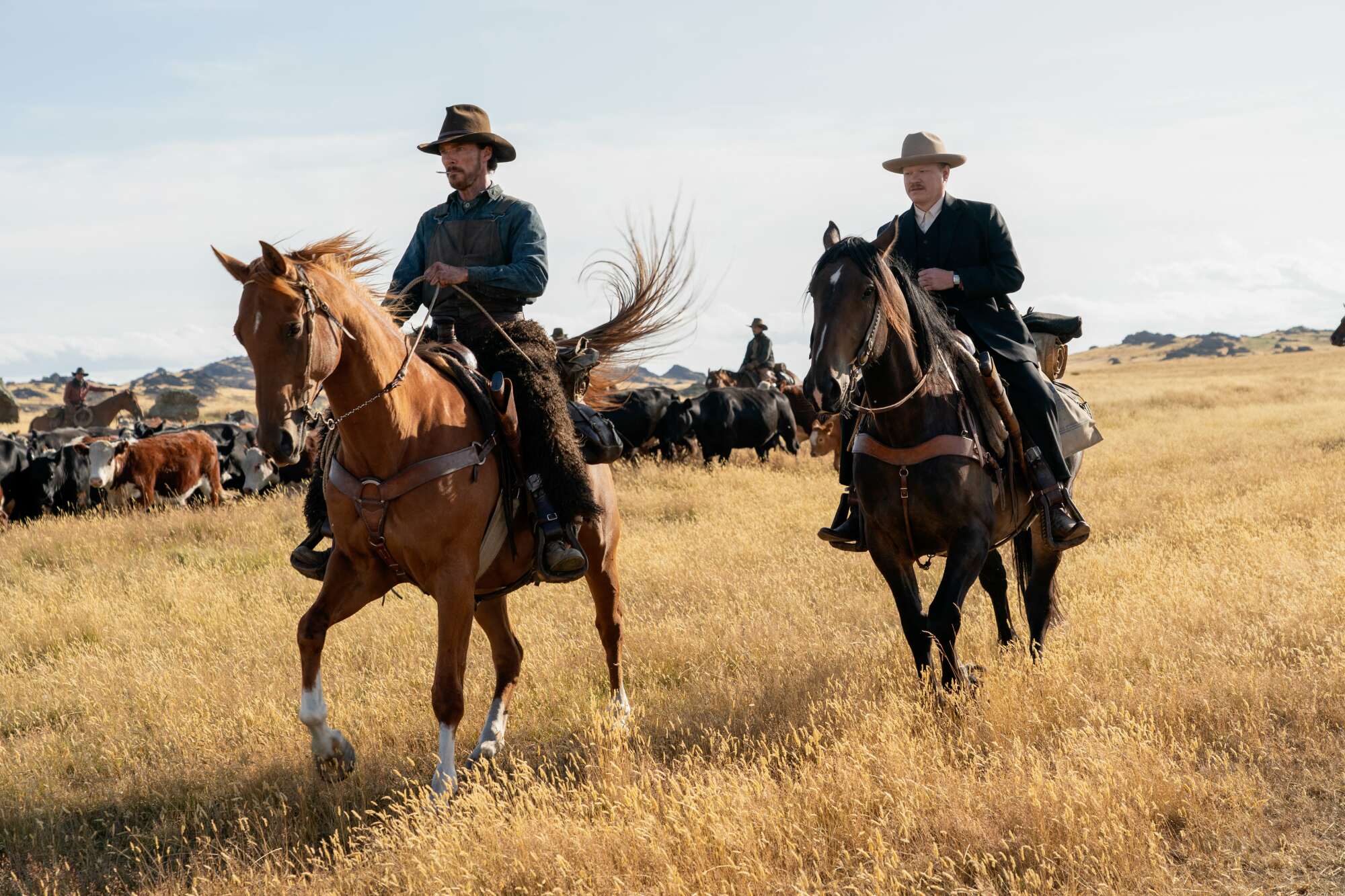 Benedict Cumberbatch and Jesse Plemons ride horses in 'The Power of the Dog.' 