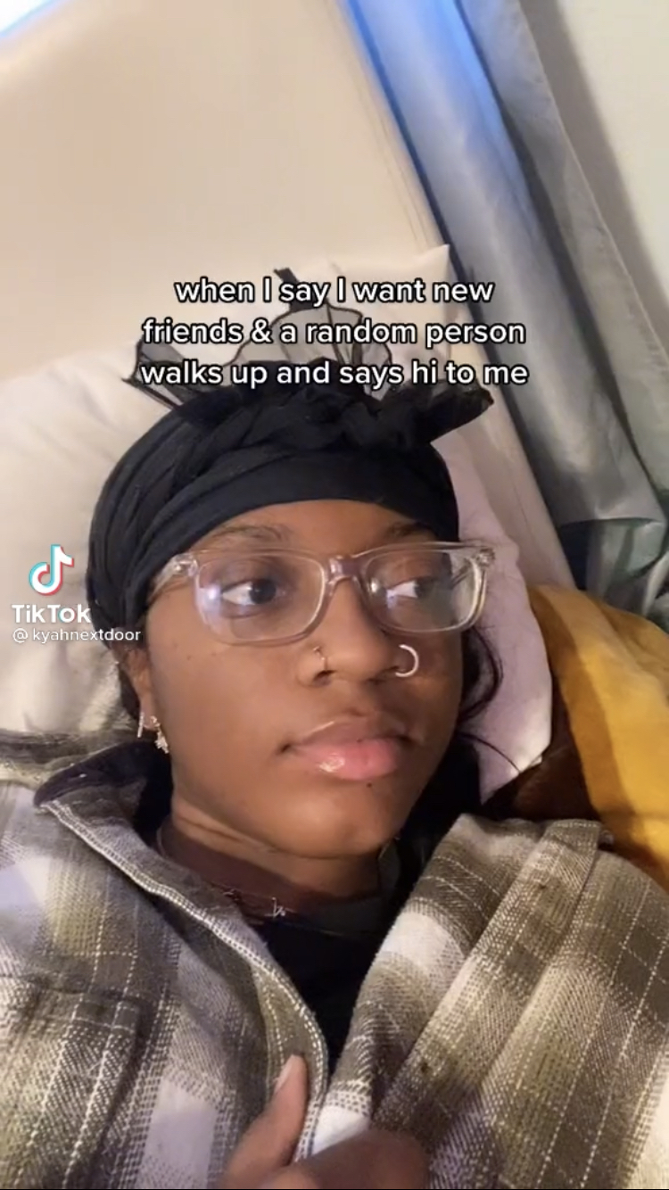 @kyahnextdoor's TikTok reading "when I say I want new friends & a random person walks up and says hi to me."