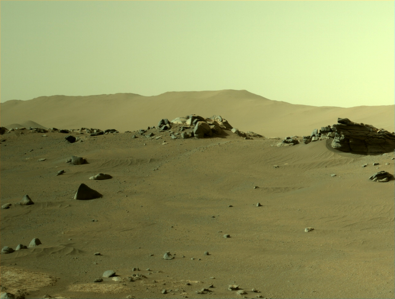 A look at the sandy, windswept surface of Mars, peppered with rocks, as captured by NASA's Perseverance rover.
