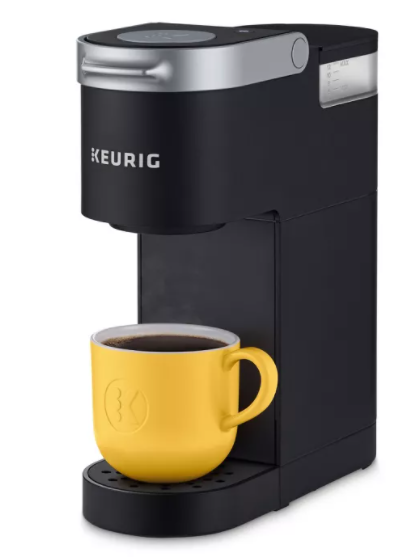 black single cup coffee maker with a yellow cup