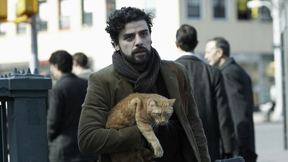 Oscar Isaac with a cat in "Inside Llewyn Davis".