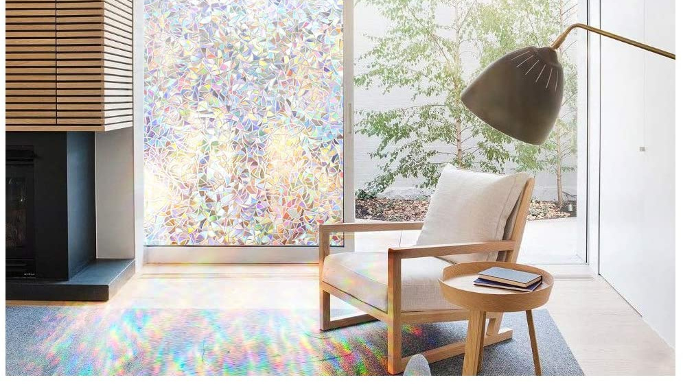 Image of room with window decal filtering colorful light through the glass