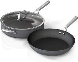 Two black pans and a glass lid