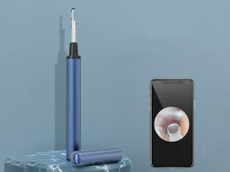 Blue ear cleaner next to phone screen showing picture of inside of ear canal