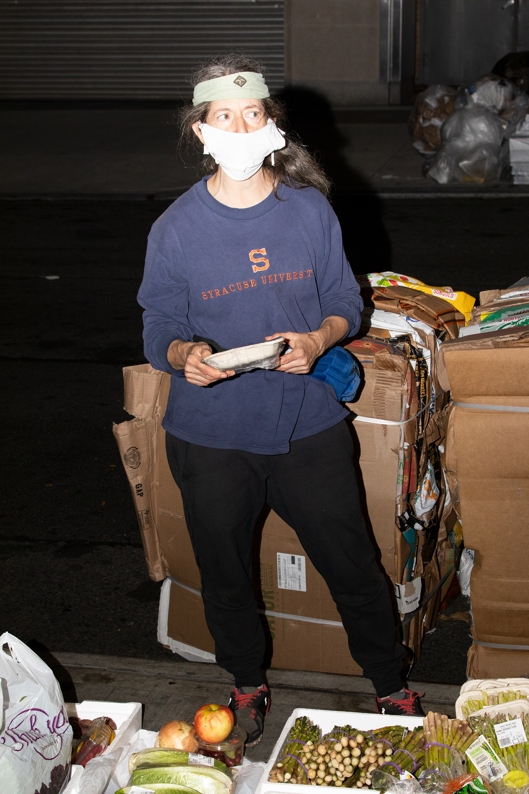 Janet standing behind abundance of found produce