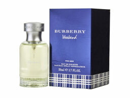 Clear bottle of cologne next to blue box