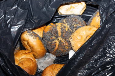 garbage bag containing multiple bagels